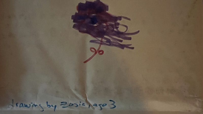 a child's drawing of a flower on an envelope